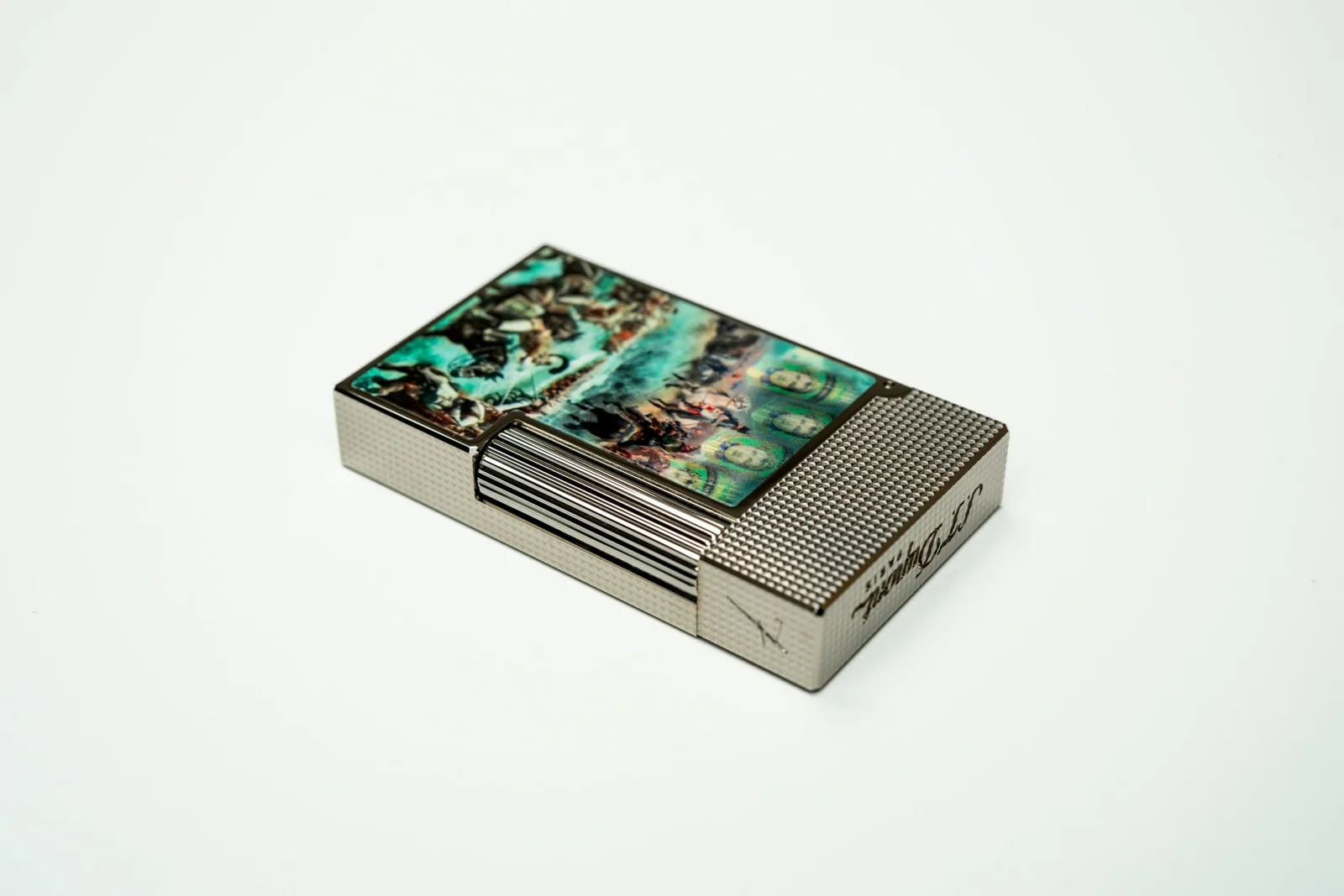 ST Dupont X El Septimo luxury cigar lighter with palladium and diamond head guilloche pattern.
